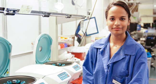 A girl standing in the laboratory as a technician